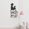 cuadro niña sentada arriba de libros 24 x 45 cm